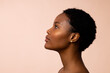 © WavebreakMediaMicro - Profile of african american woman with short hair looking up, copy space