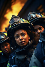Generative AI Image Portrait Of Young Women Black Firefighters In Uniform And Hard Hat Against A Blurred Background Of Orange Fire And Smoke