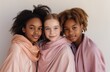 © artem - Three african-american girls in pastel clothes posing in studio