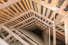 Wooden Roof Structures. Interior Of Cold Unheated Loft.