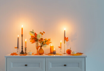 Poster - beautiful autumn home decor with burning candles in white interior