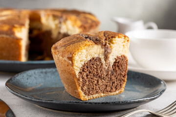 Wall Mural - Marble cake and cup of coffee on the table.