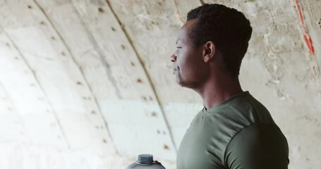 Poster - Fitness, break and a black man drinking from a water bottle on the beach during cardio or performance training. Exercise, hydration and a sports runner or athlete on the coast for a wellness workout