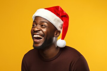 Poster - Dark-skinned man wearing a Santa Claus hat