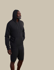 portrait of a black man in hoodie