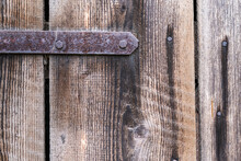Old Wooden Door With Rusty Hinge, Close-up, Background.