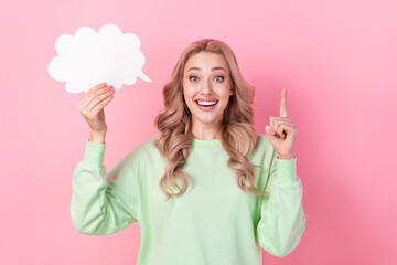 Photo of scientist girl blonde hair holding bubble paper cloud green sweatshirt finger point up eureka isolated on pink color background