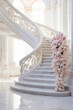White marble stairs decorated with pink and white roses. Luxury interior in light tones, wedding decoration. Generative AI