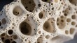 Porous structure of pumice stone captured in detail.