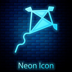 Poster - Glowing neon Kite icon isolated on brick wall background. Vector