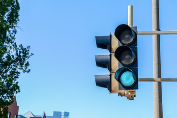 View of green traffic light in city, closeup