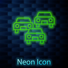 Sticker - Glowing neon line Traffic jam on the road icon isolated on brick wall background. Road transport. Vector