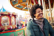 © Jasmina - Smiling young Afro man having fun in amusement park Prater in Vienna