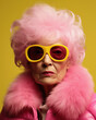 © ROC WILL - Close-up photo of an amazing charming European pink curly haired old woman, Pink hair and dress with yellow sunglasses, poster banner header with copy space