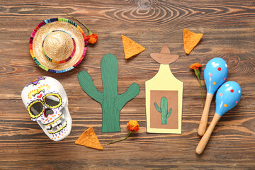 Wall Mural - Composition with Mexican symbols with nachos for Independence Day on wooden background