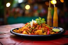 A Delicious Dish Of Typical Pad Thai On A Table In A Thai Restaurant