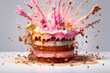Multicolored cake explosion on light background