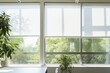 Office window covered with white roller blinds, offering sun protection while providing a view of the garden. Generative AI