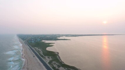 Wall Mural - Aerial View of Hatteras Island Heading Along the Shore Towards Hatteras Village as the Sun Sets