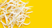 Bean sprouts on yellow background