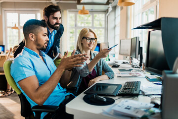 Young and diverse group of people working together in a startup company office