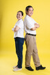 © 1112000 - portrait of middle aged asian couple posing on yellow background
