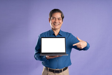 portrait of middle aged asian business man posing on purple background