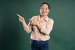 © 1112000 - Gangang middle-aged Asian female portrait posing on blue background