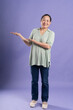 © 1112000 - Gangang middle-aged Asian female portrait posing on purple background