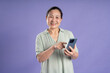 © 1112000 - Gangang middle-aged Asian female portrait posing on purple background