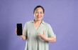 © 1112000 - Gangang middle-aged Asian female portrait posing on purple background
