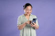 © 1112000 - Gangang middle-aged Asian female portrait posing on purple background
