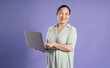 © 1112000 - Gangang middle-aged Asian female portrait posing on purple background
