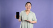 © 1112000 - Gangang middle-aged Asian female portrait posing on purple background