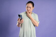 © 1112000 - Gangang middle-aged Asian female portrait posing on purple background