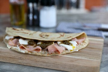 Wall Mural - Italian cuisine , Piadina with Italian ham and cheese