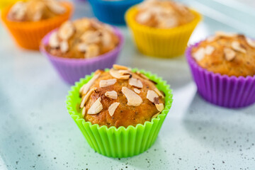 Wall Mural - Lemon poppy seed muffins garnished with almond slivers