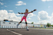 © diy13 - Cute smiling girl in roller skates and helmet in stadium. Pretty child, kid riding roller. Close-up portrait of cheerful school girl looking at camera wearing protective equipment.