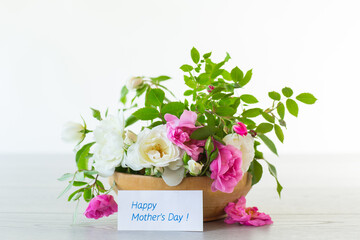 Sticker - A small bouquet of beautiful summer pink and white roses on a light background.