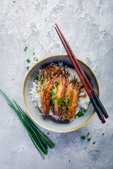 Canvas Print - Rice with enoki mushrooms and chives. Asian vegan diet meal.