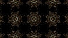 Dynamic Animation Of Traditional Floral Ornaments Made Of Small Particles. Yellow Kaleidoscope Pattern On A Dark Looped Background.