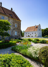 Austria, Upper Austria, Obernberg Am Inn, Flowers Blooming In Garden Of Obernberg Castle