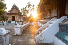 Tourists Appreciate The Ancient Buddhist Temple In Luang Prabang.