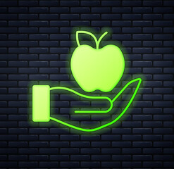 Sticker - Glowing neon Apple icon isolated on brick wall background. Excess weight. Healthy diet menu. Fitness diet apple. Vector