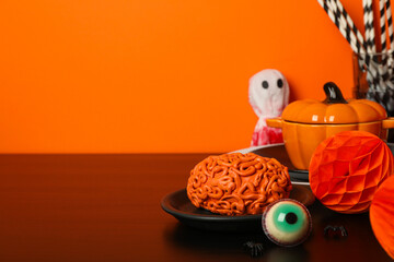 Wall Mural - Table setting for Halloween, scary decorations with pumpkins