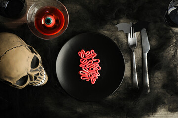 Wall Mural - Spooky holiday table decorations with a skull for Halloween