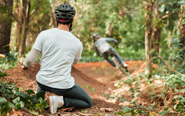 Wall Mural - Man, bicycle and forest with photographer, speed and off road for race, cycling video or post on web blog. Guy, bike and recording for vlog, live stream or social network in woods for outdoor sports