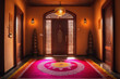 A decorated entrance of a home, with intricate rangoli patterns on the ground