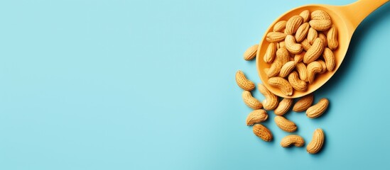 Poster - Unshelled peanuts on isolated pastel background Copy space