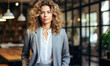 © Bartek - Modern corporate woman in a suit posed in a spacious office.